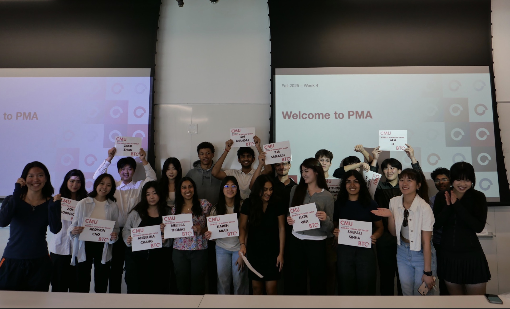 Fall 2025 PMA cohort welcome session, members holding name cards